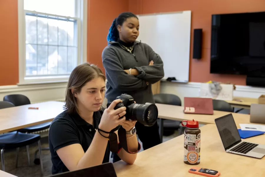 Yesterday, two presidential campaigns designed by Bates students faced a scandal, and each team had 90 short minutes in which to respond.

A blessedly mock campaign, it’s a component of “Presidential Campaign Rhetoric,” which Professor of Rhetoric, Film, and Screen Studies Stephanie Kelley-Romano has taught every couple of years since the early 2000s.

This year, Kelley-Romano asked each campaign to prepare two responses. “One where they have to address (minimize and justify) what went on and a second where they can totally deny it. At the end of the class period I will have another story for each campaign that shows the accusations were false and they are absolutely vindicated (these stories can then run in our fake newspaper without the danger of damaging the candidate images or campaigns). During the class there will also be other information that "breaks" that they will have to respond to

The course is a senior seminar, and part of its coursework is traditional. Students do readings and have discussions, getting a handle on the many rhetorical devices that presidential campaigns deploy in speeches, ads, debates, and social media, as well how the news media interprets all this political discourse.

Simultaneously, the students get to practice and hone their rhetorical skills during the mock campaign. Everyone in the class has a role, from doing social media and speechwriting to playing family members and news reporters.

For the first time, this year’s two campaigns will not be affiliated with either of the two major U.S. parties (nor with any other party, whether Greens, Libertarians, or even Whigs).

Getting rid of the labels, Kelley-Romano hopes, will make “voters,” the nearly 600 students who are in various courses that intersect with the campaign, “think twice about what they’re hearing.” While an overall goal of the mock campaign is to increase the quality of public discourse, it’s up to each campaign to “balance responsible discour