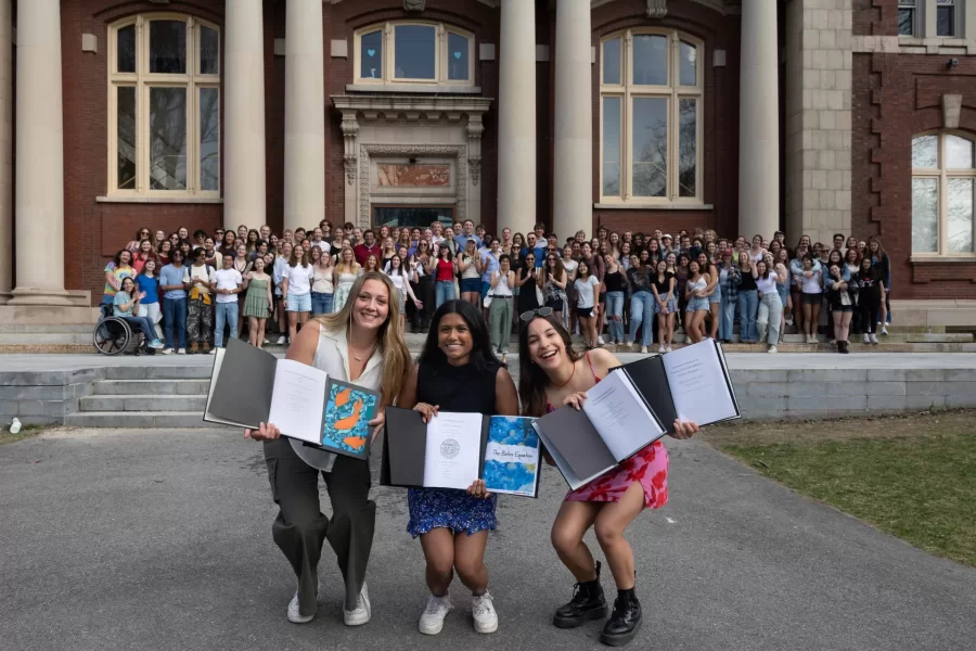 Francisca, Mallika and I have been friends since the first day of freshman year as we all lived in Page Hall on the 4th floor. Francisca and Mallika were first-year roommates and Francisca and Livia met through their Calc II class and became closer after forming a study group for it.  After the first day of classes, Livia invited Francisca to her birthday get-together that night, Mallika tagged along, and the rest was history! We all stayed very good friends for the entirety of our college careers and are very thankful for having each other through a very stressful freshman year. Living through freshman year with all of the COVID restrictions brought us closer together and here we are four years later still best friends (and all Math majors). 

For the binding today, Mallika Jena and I bound our math capstone first. We took Katy Ott's math capstone class titled Mathematical Exposition, where our class produced a collaborative final math magazine for the audience of undergraduate mathematics majors or potential majors. The magazine is titled, The Bates Equation, and specifically includes Mallika's and I's written work that analyzes primary sources of mathematical literature associated with the Pythagorean theorem, which we all know and love.

Your name: Maria Francisca Rocha
Hometown: Porto, Portugal
Majors: Biochemistry, Mathematics
The title of each of your theses and advisor:
•	“Mathematical Model of the Response of Bacterial Biofilms to Antibiotic Treatments” Professor Colleen O'Loughlin.- Professor Meredith Greer, Mathematics department
•	“Characterizing the morphology of Staphylococcus epidermidis bacterial biofilms using scanning electron microscopy”
Guests: I am part of the frisbee team, I work at the Office of Global Education, and I am one of the Managers of the Ronj, so I invited my teammates, coworkers, and friends from those groups and beyond! 
Quote: It was heartwarming to see all my friends gathered to celebrate the culmination of my work a