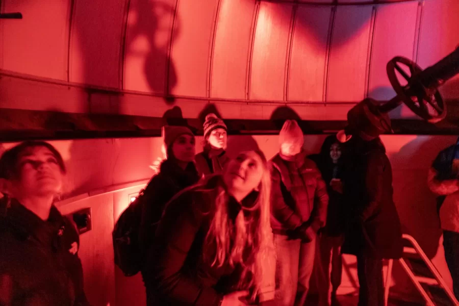 Evan Boxer-Cook ’26, of Scarborough, Maine, leads the Bates Astronomy Club from Carnegie 321 to the Stephens observatory, located on the roof of Carnegie, on January 15, 2025. (Theophil Syslo | Bates College)
