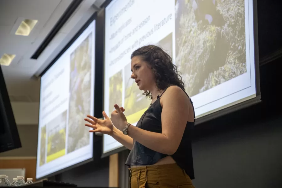 Lucy Hensley '25 presents her Biology thesis research in the Research in STEM panel on Littorina obtusata prey responses to European green crabs, detailing possible next steps for the study to obtain more conclusive results.