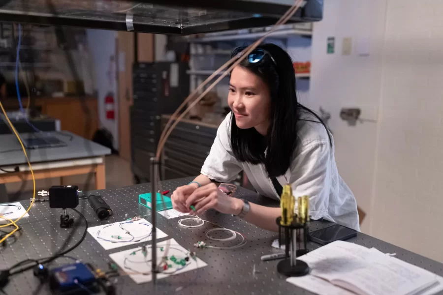 Assistant Professor of Physics Ryan Cole works with students in his Carnegie Science 156 lab on June 20, 2025. There is a secondary lab pictured in some of the photos that he and Paloma visited wearing goggles, where they used a laser to measure light frequencies. 

“Every once in a while, science makes sense,” he said at one point to the students.



“Paloma is building an instrument to study very precisely sunlight and specifically the spectrum of sunlight for applications ultimately in exoplanets (planets orbiting other stars)  detection and characterization.

And then this table, which is Carson, Quinn, and Audrey (and Andrew Liu who is not here today) They are measuring how atmospheric gases like methane — specifically green house gases — interact with light to ultimately help us measure those things better in the atmosphere.

Students photographed:

Audrey Schane ’25, physics major, who is working as a research assistant with Cole this summer,
Shown at the computer (striped t-shirt), where she is looking at a gas sample where she’s building something to control gas temperatures, with a vaccuum on the bottom. 

Paloma Rodriguez ’26, a physics major (black t-shirt)

Carson Moellering ’26, physics major, looking at how methane absorbs light in different conditions (light reflecting back and forth in mirrors (white t-shirt)

Qwynn Kobertz ’26, double major in physics and studio art, using a DSR laser exploring how to use this laser in a methane detecting app. (sunglasses on head) Here are two quick links that may help with some context for what we're doing in the lab.

My research website: https://sites.google.com/bates.edu/colelab/research-areas?authuser=0

NIST Article on optical frequency combs: https://www.nist.gov/topics/physics/optical-frequency-combs
