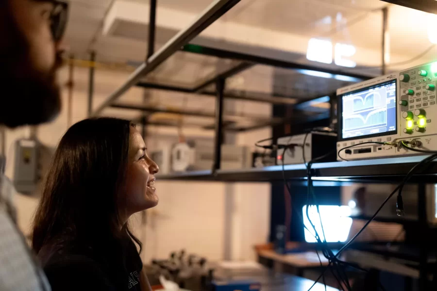 Assistant Professor of Physics Ryan Cole works with students in his Carnegie Science 156 lab on June 20, 2025. There is a secondary lab pictured in some of the photos that he and Paloma visited wearing goggles, where they used a laser to measure light frequencies. 

“Every once in a while, science makes sense,” he said at one point to the students.



“Paloma is building an instrument to study very precisely sunlight and specifically the spectrum of sunlight for applications ultimately in exoplanets (planets orbiting other stars)  detection and characterization.

And then this table, which is Carson, Quinn, and Audrey (and Andrew Liu who is not here today) They are measuring how atmospheric gases like methane — specifically green house gases — interact with light to ultimately help us measure those things better in the atmosphere.

Students photographed:

Audrey Schane ’25, physics major, who is working as a research assistant with Cole this summer,
Shown at the computer (striped t-shirt), where she is looking at a gas sample where she’s building something to control gas temperatures, with a vaccuum on the bottom. 

Paloma Rodriguez ’26, a physics major (black t-shirt)

Carson Moellering ’26, physics major, looking at how methane absorbs light in different conditions (light reflecting back and forth in mirrors (white t-shirt)

Qwynn Kobertz ’26, double major in physics and studio art, using a DSR laser exploring how to use this laser in a methane detecting app. (sunglasses on head) Here are two quick links that may help with some context for what we're doing in the lab.

My research website: https://sites.google.com/bates.edu/colelab/research-areas?authuser=0

NIST Article on optical frequency combs: https://www.nist.gov/topics/physics/optical-frequency-combs