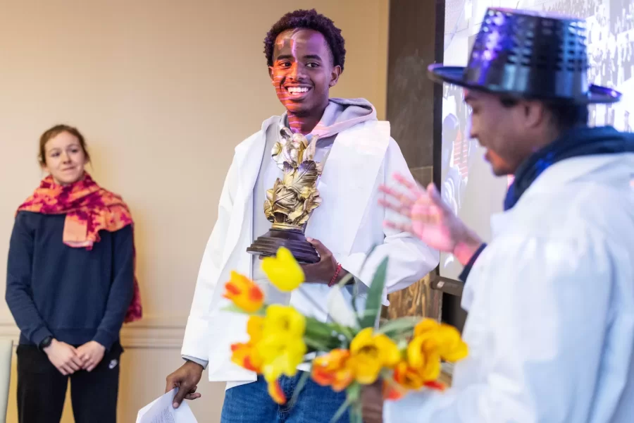 Moments from inside Laura Balladur's course FR205 in Roger WIlliams Hall captured on March 16th, 2026. Monday's are a performance day and often include theater-based games and improv.(Theophil Syslo | Bates College)

Laura Balladur is Lecturer in the French and Francophone Studies department at Bates College since 2003. Her broad interests include translation both in theory and practice, cinema, the relationship between literature and science, and the embodied mind. Her dissertation “Imagination, Physiology, and the Dynamics of Representation” (2005) explored the emergence of proto-biology in various 17th and 18th-century scientific texts in Europe. She has published on translation as well as on the history of science. Her latest article offered an alternate reading to Descartes’s dualism. True to her other undergraduate degree in Studio Arts, she keeps returning to her interest in creative projects. Currently, she is working on a creative non-fiction project describing our relationship with the Democratic Republic of the Congo, both past and present. With a generous Faculty Development Grant (April 2022), she traveled to the colonial archives in Brussels, followed by a trip to the Democratic Republic of Congo, in the North and South Kivu capitals: Goma, in the foothills of Mt Nyiragongo, and Bukavu, at the southern tip of Lake Kivu. She wanted to follow the imprints of colonial-era infrastructures onto the present-day territory. The collected voices from the many guides she met reveal the lasting wounds of colonialism with its persisting extractive economies that form the bedrock of our modern life. During the trip to the DRC, she taught a two-hour workshop on The Art of Creative Non-Fiction at the Université Catholique de Bukavu. In Fall 2022, students in her translation course met over Zoom with a few students from Bukavu who participated in that summer’s workshop. Her students’ translations along with the originals can be found here: Bridges to Bukav