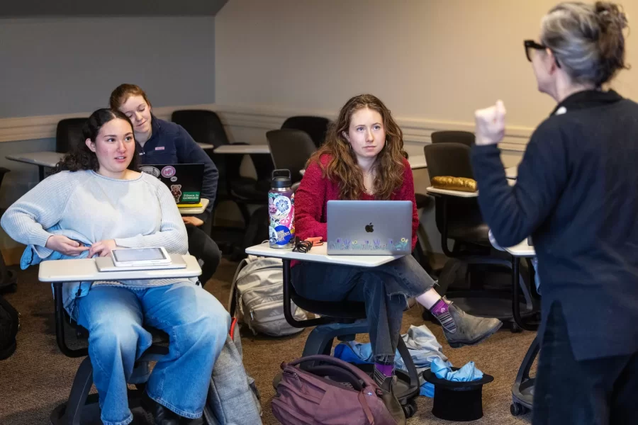 Moments from inside Laura Balladur's course FR205 in Roger WIlliams Hall captured on March 16th, 2026. Monday's are a performance day and often include theater-based games and improv.(Theophil Syslo | Bates College)

Laura Balladur is Lecturer in the French and Francophone Studies department at Bates College since 2003. Her broad interests include translation both in theory and practice, cinema, the relationship between literature and science, and the embodied mind. Her dissertation “Imagination, Physiology, and the Dynamics of Representation” (2005) explored the emergence of proto-biology in various 17th and 18th-century scientific texts in Europe. She has published on translation as well as on the history of science. Her latest article offered an alternate reading to Descartes’s dualism. True to her other undergraduate degree in Studio Arts, she keeps returning to her interest in creative projects. Currently, she is working on a creative non-fiction project describing our relationship with the Democratic Republic of the Congo, both past and present. With a generous Faculty Development Grant (April 2022), she traveled to the colonial archives in Brussels, followed by a trip to the Democratic Republic of Congo, in the North and South Kivu capitals: Goma, in the foothills of Mt Nyiragongo, and Bukavu, at the southern tip of Lake Kivu. She wanted to follow the imprints of colonial-era infrastructures onto the present-day territory. The collected voices from the many guides she met reveal the lasting wounds of colonialism with its persisting extractive economies that form the bedrock of our modern life. During the trip to the DRC, she taught a two-hour workshop on The Art of Creative Non-Fiction at the Université Catholique de Bukavu. In Fall 2022, students in her translation course met over Zoom with a few students from Bukavu who participated in that summer’s workshop. Her students’ translations along with the originals can be found here: Bridges to Bukav