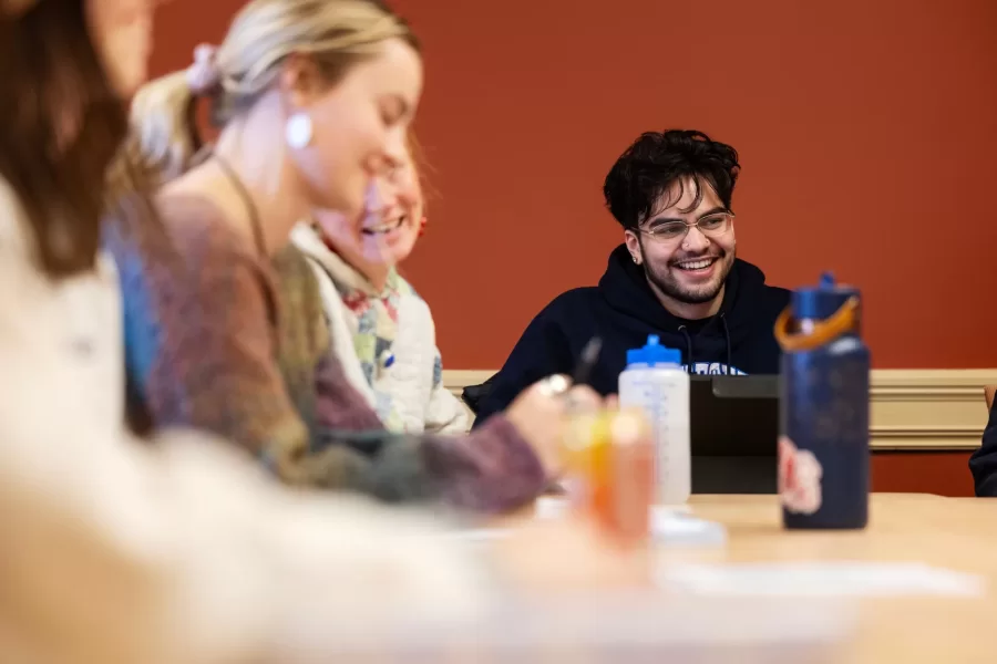 Four students engage in a class discussion during a Race and Tobacco class in Roger Williams Hall.