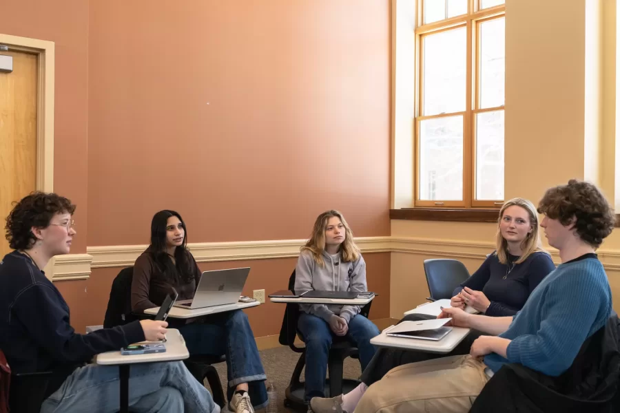 A group of students have a discussion during an Asian Studies Samurai class in Hedge Hall.
