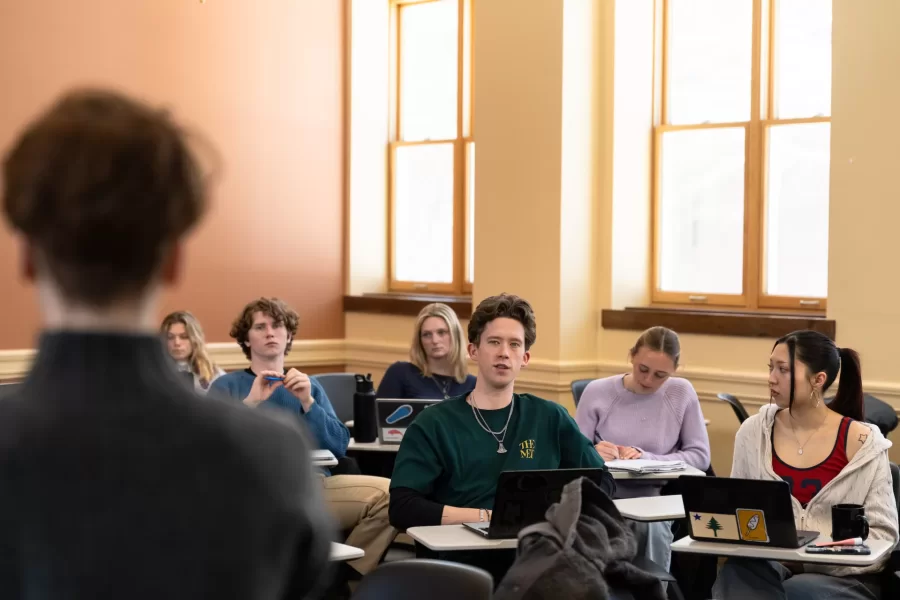 A student speaks to their peers during an Asian Studies Samurai class in Hedge Hall.