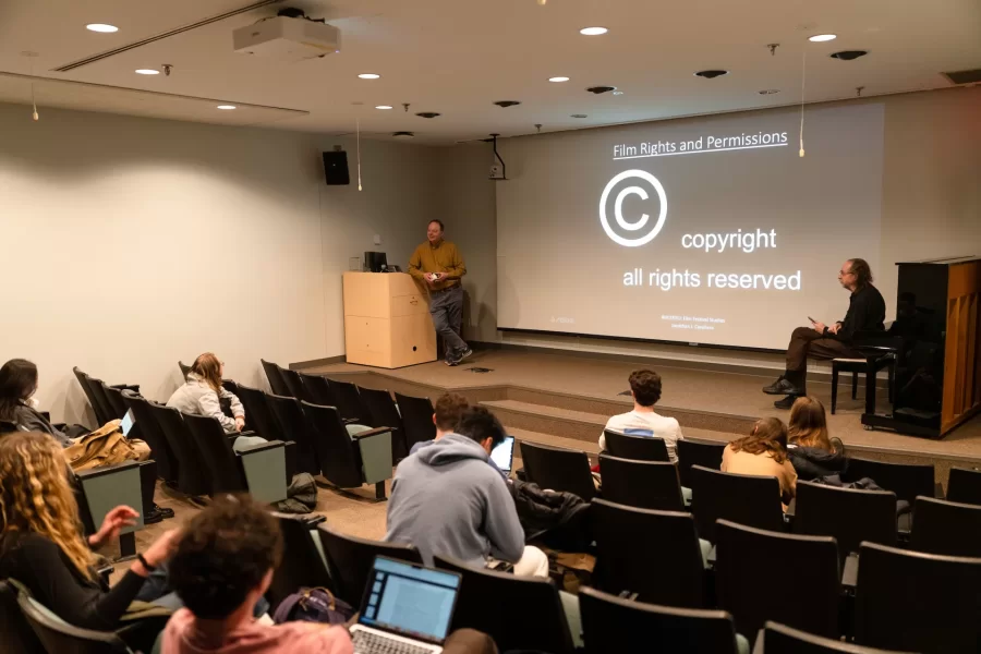 Lewiston, ME, United States  -- Professor Jonathan J. Cavallero talks to students about planning the upcoming film festival at the beginning of his Film Festival Studies in Olin Arts Center 105 at Bates College in Lewiston, ME on Wednesday, March 25, 2026. Students discussed showing a film by a Bates alum and issues with copyright. (Photo by Yoon S. Byun) © 2026 Strewn Wonder, LLC