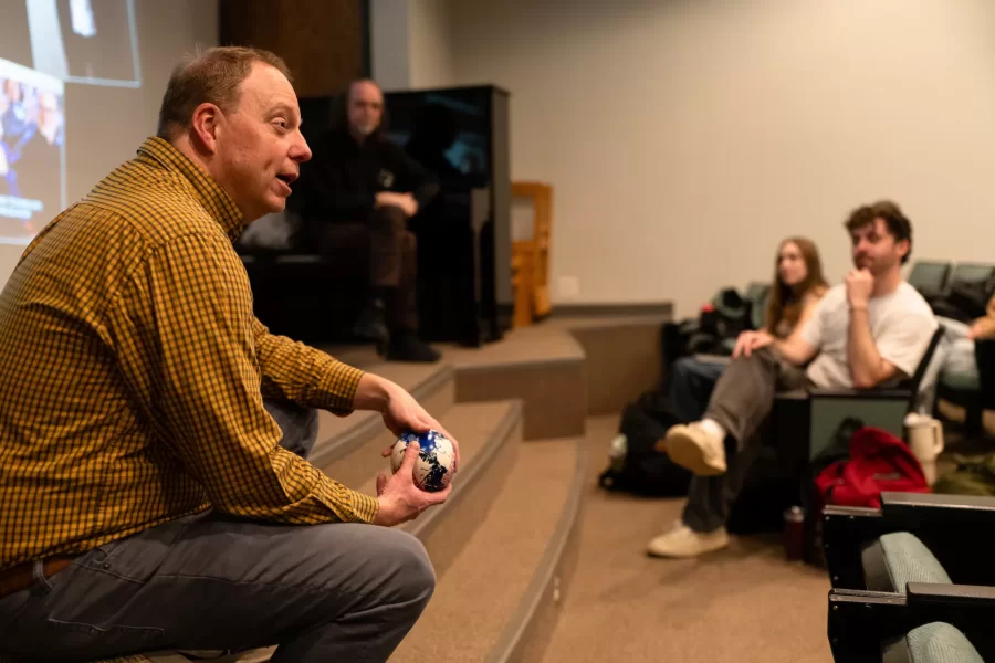 Lewiston, ME, United States  -- Professor Jonathan J. Cavallero talks to students about planning the upcoming film festival at the beginning of his Film Festival Studies in Olin Arts Center 105 at Bates College in Lewiston, ME on Wednesday, March 25, 2026. Students discussed showing a film by a Bates alum and issues with copyright. (Photo by Yoon S. Byun) © 2026 Strewn Wonder, LLC