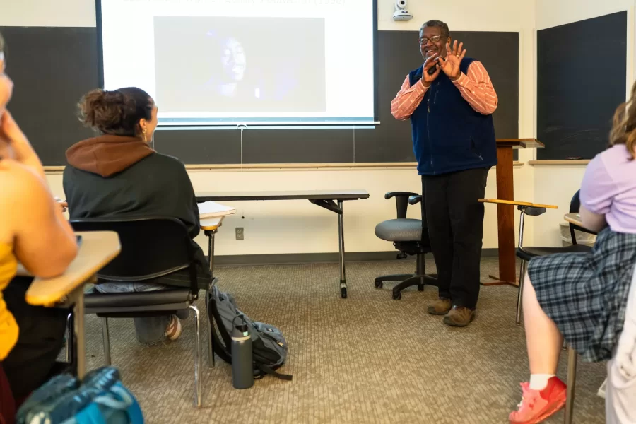 A professor projects a presentation and talks about the movies “Bullworth” and “Moonlight” during a Reimagining Africana class in Pettigrew Hall.