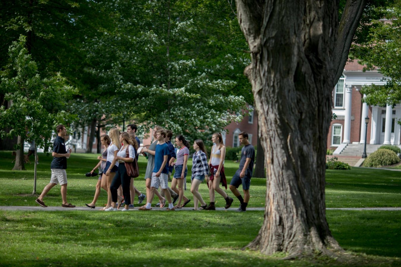 "The best part about most days is talking to students and parents and seeing how excited they get when they hear about unique Bates traditions."
.
-- Admission Summer Intern Zach Collester, a neuroscience major from Doylestown, Pa., takes a question at the end of an Admission tour that returns to Lindholm House on Campus Avenue.
Kathryn Weidmann '19 of Milton, Mass., an admission summer intern and double major in history and psychology, leads an admission tour across the Historic Quad.