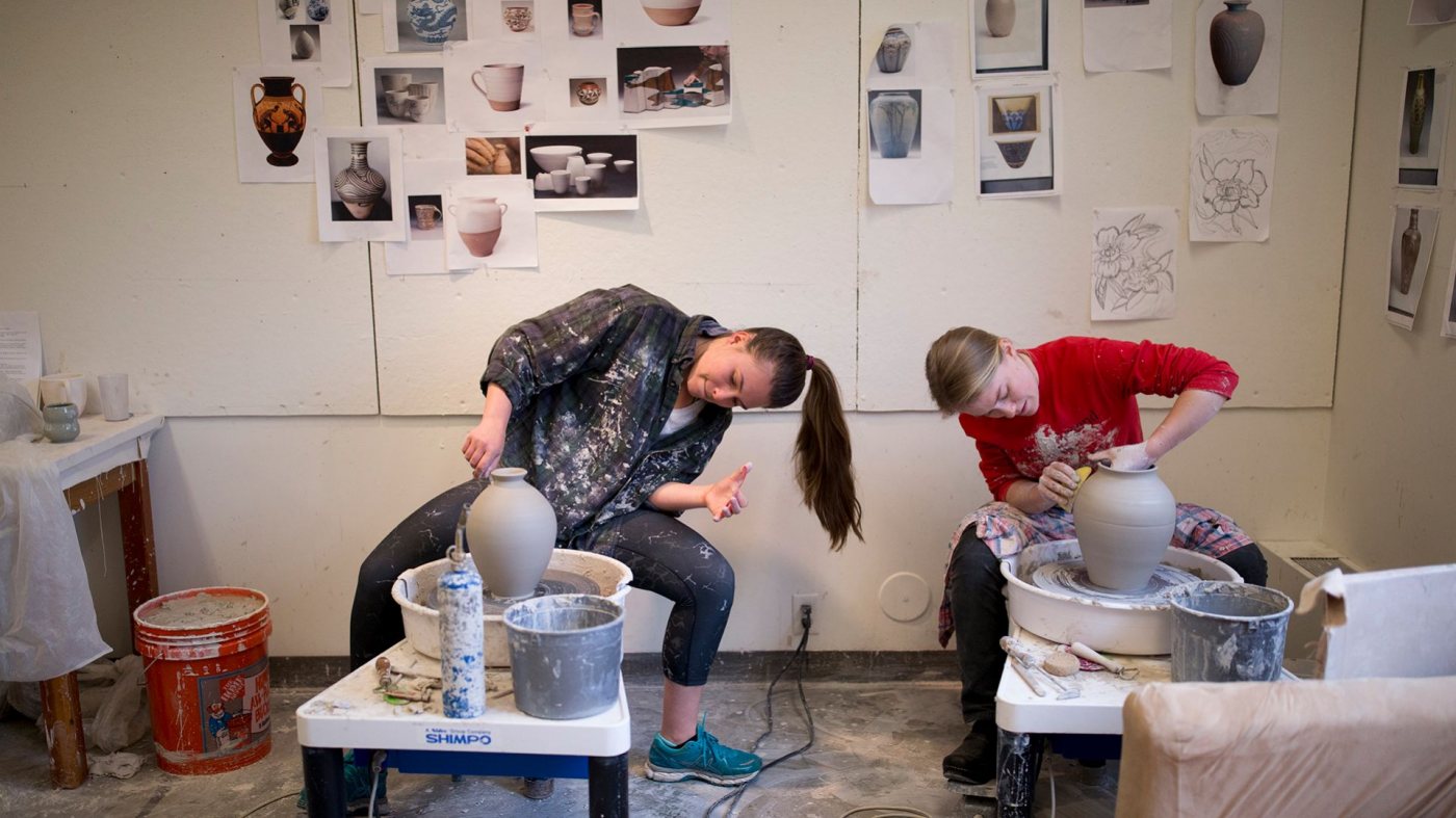 Natalie Silver '16 of Bennington, Vt., a double major in studio art and history, and Sasha Lennon '16 of Cape Elizabeth, a double major in studio art and psychology, prepare for their senior exhibition in their ground-floor Olin Arts studio. Both co-directors of 2015 AESOP, they are good friends and fellow artists who share not only a studio but also a sensibility for the balance of form and function in their ceramic art. They are close to the end of their preparations but are still throwing pots for their final show at Bates.