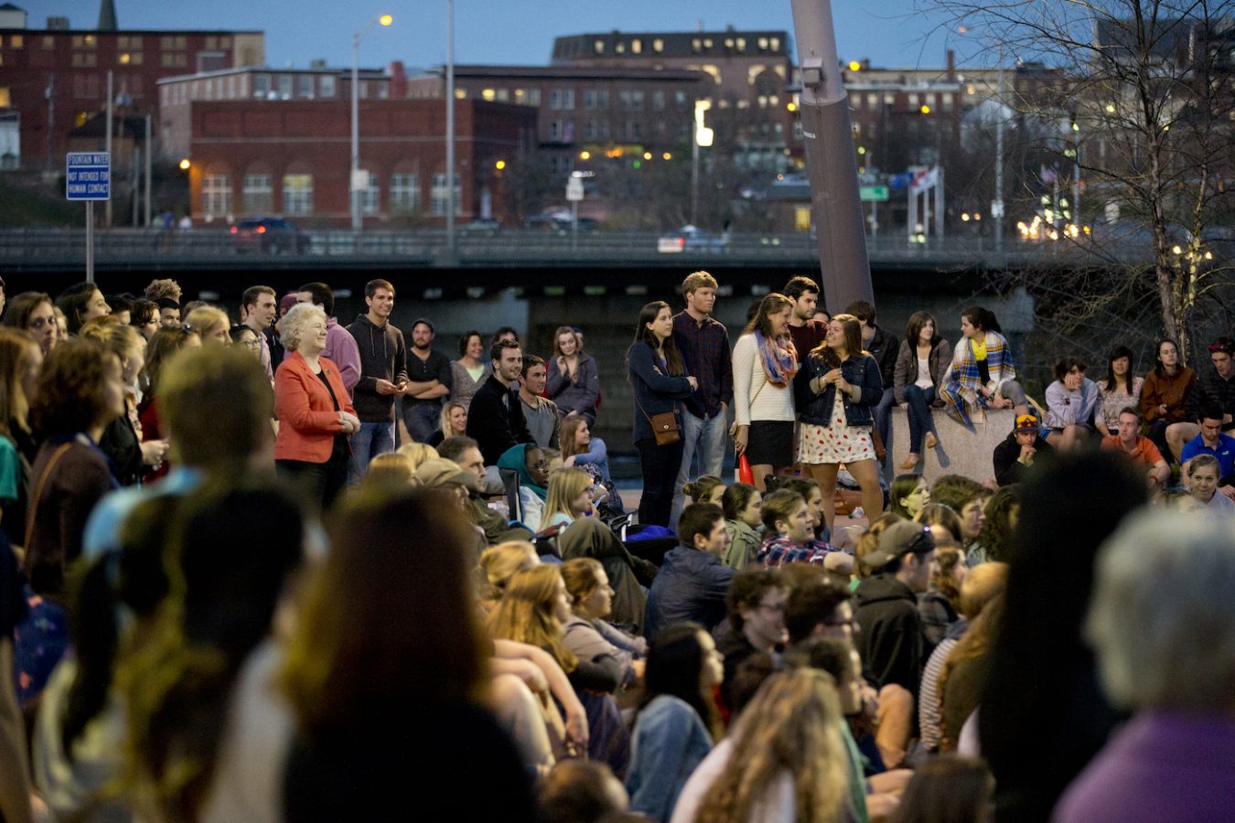 A crowd enjoys Bates student performances in Auburn’s Festival Plaza.