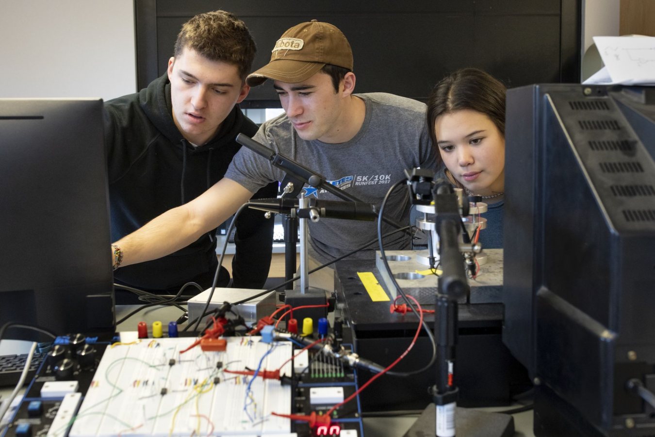 Associate Professor of Chemistry and Biochemistry Matthew Côté with students in his first-year seminar.FYS 336 - Nanotechnology Project: Manipulating AtomsA hands-on introduction to the interdisciplinary field of nanotechnology-technology based on nanometer-scale structures. Students break into groups and become "specialists" to complete a class-wide collaborative nanotechnology project. Possible projects include designing and building a simplified scanned probe microscope, and fabricating and characterizing nanostructures. Students learn to identify and organize the tasks required of a long-term project. Clear and effective communication is emphasized as students work within and among groups, give brief talks, and write more formal papers. No previous experience is assumed, but the collaborative nature of the seminar requires the full and active participation of all participants. After building a scanning tunneling microscope, in lieu of a final exam, the students, in three groups -- computer programming, electronics,, and mechanical design -- gathered in Carnegie Science to prepare posters of their work for the 2020 Mount David Summit and receive feedback from the other groups to finalize their presentations.Three students looking at the mechanical piece are Vangjel Xhollo '23 of Turner, Maine (in black hoodie), Kyle Weinman '23 of Towson, Md., and Kaleah Haddock '23 of Junueau, Alaska. Students in first group, photographed the most together, from left to right are:Jeff Gao, Kyle Weinman, Kaleadh Haddock, Jacob Lion, Hank Lion, and Kevin Wu.Second group are Megan Strynar, in grey sweater, Gleb Tkachenko, in grey sweatshirt, Carson Pottle in black jacket and Andy Wu (white crew neck)