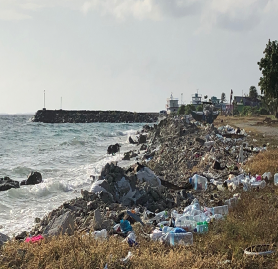 Pictured- Plastic floating the main harbour on the island as well as the side of the island where residents would routinely dispose of their trash. 
