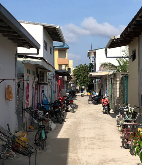 Picture of a typical street in Naifaru. There were a few cars and trucks but the most common transportation was moped or bicycle. 