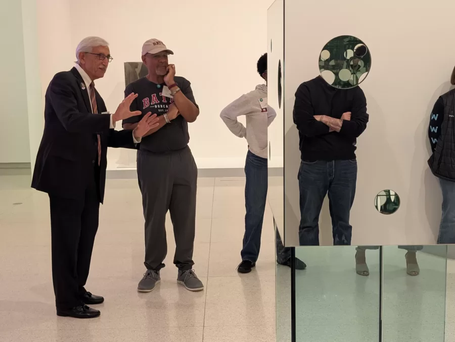 Bates alumni studying an art exhibit at The Walker in Minneapolis, MN