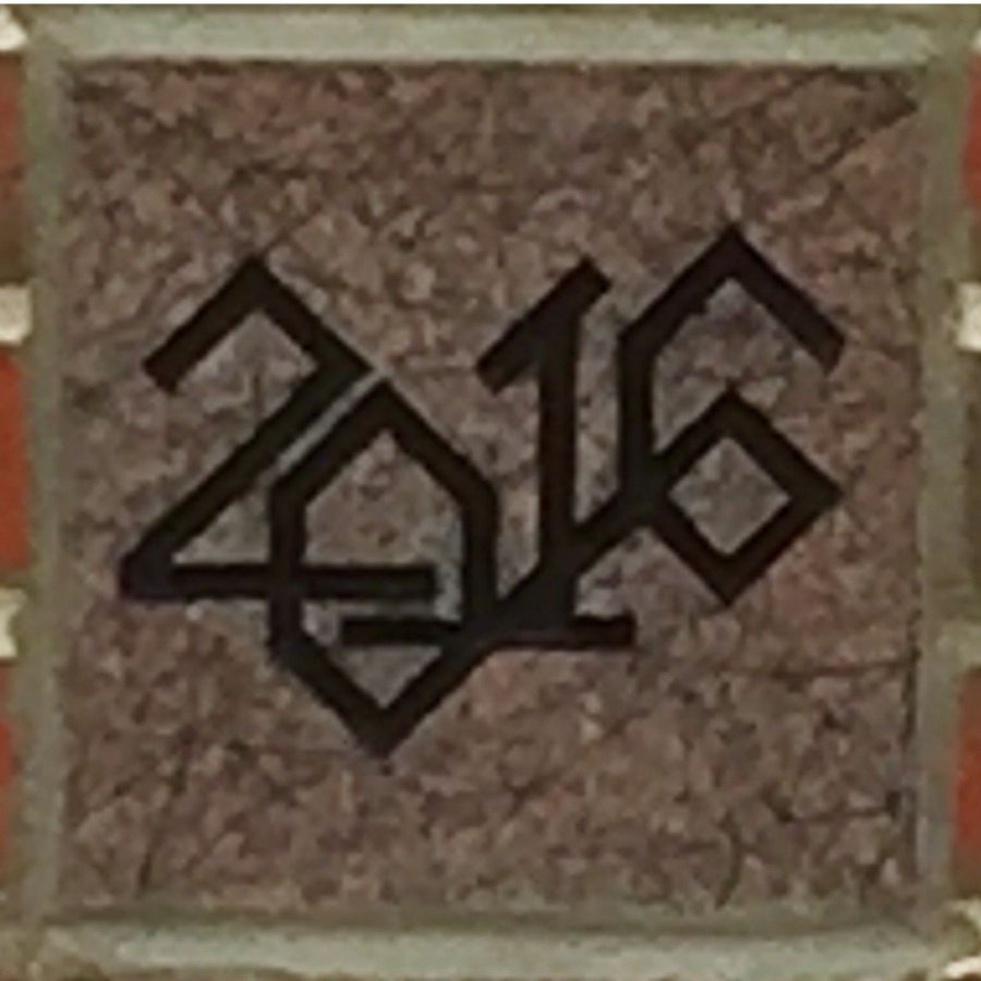 The 2016 ivy stone is on the Alumni Walk side of Pettengill