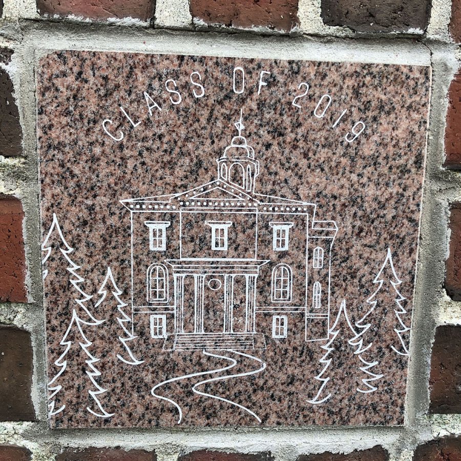 The 2019 ivy stone is on the Alumni Walk side of Pettengill