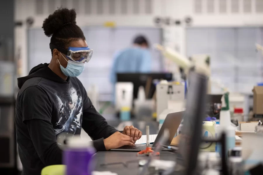 Ossie Heard ’22 of Newark, N.J., is the lab’s teaching assistant.“It was fascinating to see an actual reaction.”Students create the phenomenon of chemiluminescence during an organic chemistry lab taught by Assistant Professor of Chemistry and Biochemistry Andrew Kennedy.The reaction was tested in a darkened area just off the first-floor teaching laboratory of the Bonney Science Center: The organic compound luminol, in the presence of iron, will decompose and produce light.