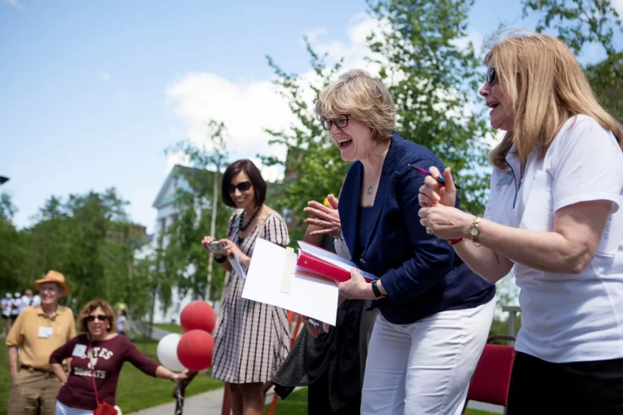 Spencer and Vice President for College Advancement Sarah Pearson '75 (right) cheer Reunion alumni during the Alumni Parade on June 7, 2014. 