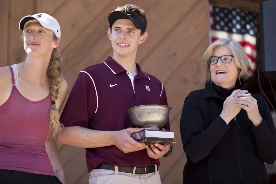 Spencer presents the President's Cup to the winning Bates rowers in April 2016.