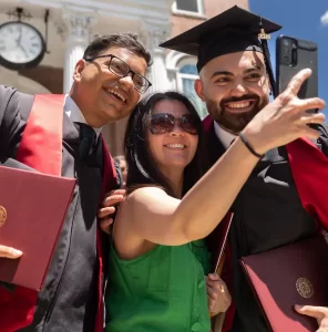 People taking a selfie during graduation