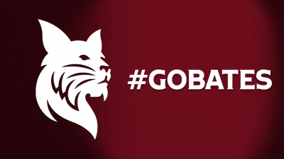 White Bobcat with GoBobcats white text over garnet background with shadow lighting