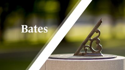 White Bates wordmark over sundial