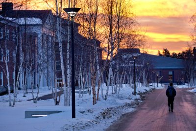 Early risers enjoy a Technicolor sunrise on Alumni Walk. (Phyllis Graber Jensen/Bates College)