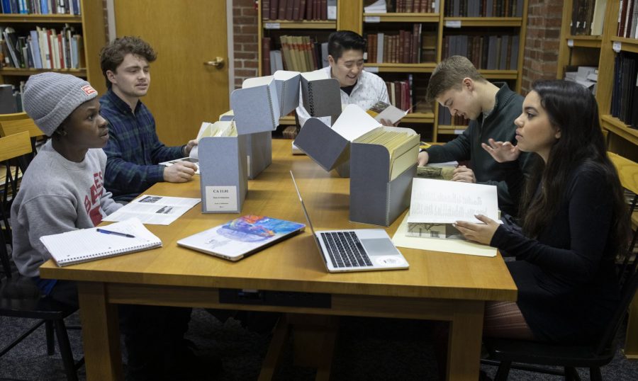 In February 2019, students in Associate Professor of History Joe Hall’s historical methods class pore over historical documents related to Bates’ founding in Muskie Archives and Special Collections Library. From left, Eric Opoku, Benni McComish, Zach Jonas, Andrew Faciano, and Ke’ala Brosseau. (Phyllis Graber Jensen/Bates College)