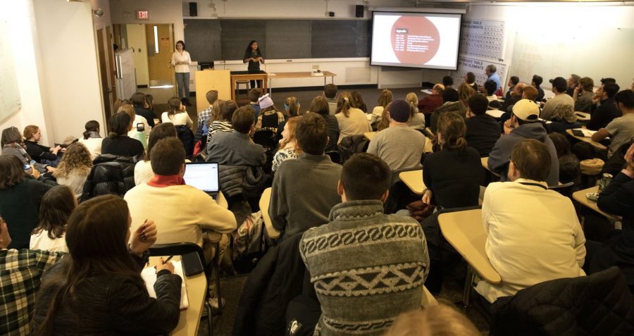 An audience fills a Dana Chemistry Hall classroom on Martin Luther King Jr. Day to hear Emma Soler ’20 and Ursula Rall ’20 lead a discussion about the college’s dual founding narratives: founded by abolitionists and funded initially by Benjamin Bates, a textile manufacturer who derived wealth from slave-grown cotton. (Phyllis Graber Jensen/Bates College)