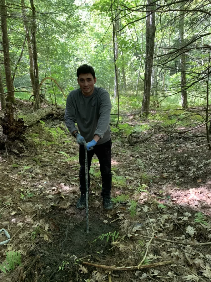Tristan Depew (Geology, 2023) coring an ancient landslide deposit in search of material for radiocarbon dating.