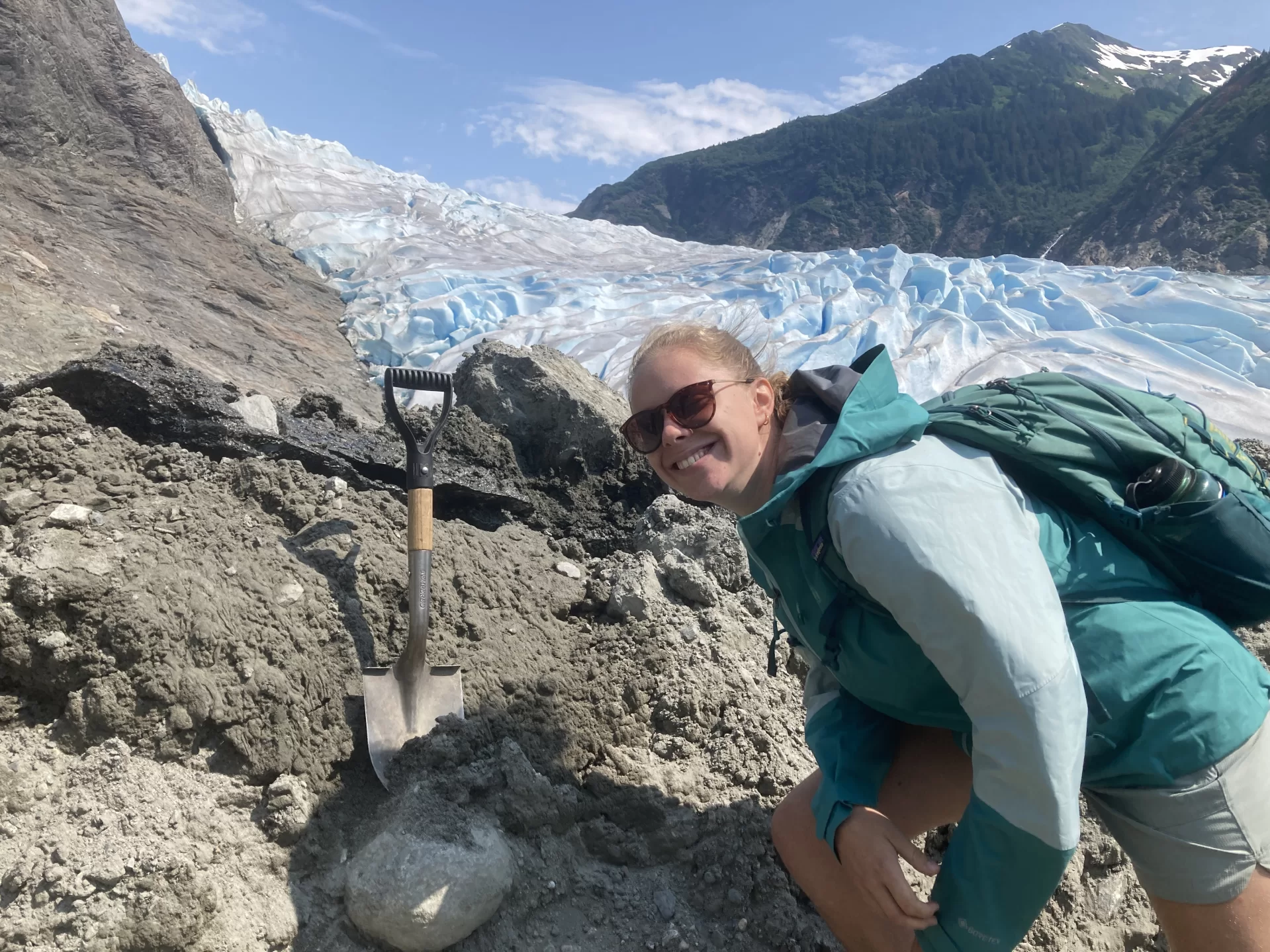 Alana Margerum (Geology, 2023) studying soil development on a recently exposed moraine in the Herbert Glacier Valley, Juneau AK.