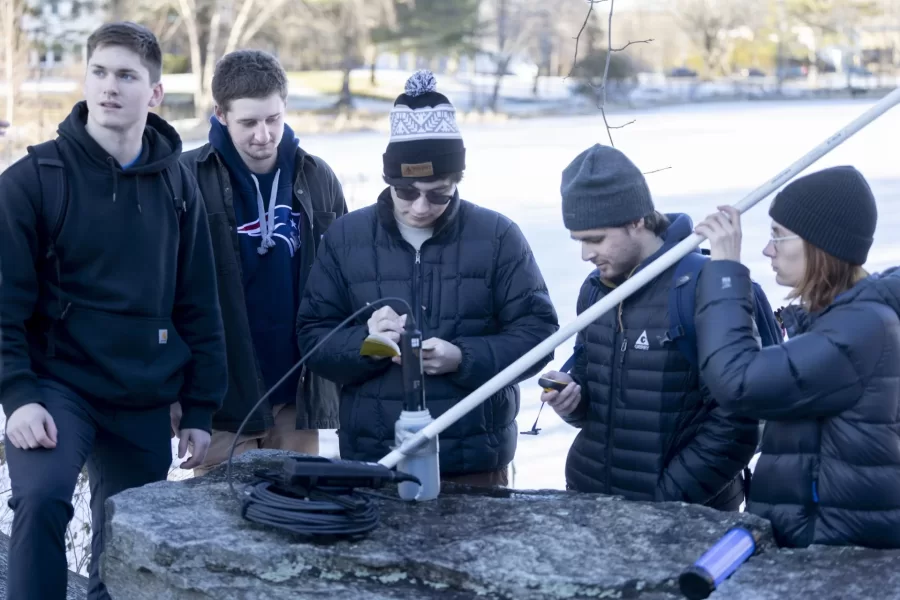 Visiting Assistant Professor of Earth and Climate Sciences Anne Fetrow leads students in her class in a lab at Lake Andrews where they learn to use scientific equipment to evaluate water qualities.

EACS 240 - Environmental Geochemistry/Lab
Environmental geochemistry draws from concepts in earth, climate, and environmental sciences, biology, and chemistry to study the behavior of natural and anthropogenic materials as they cycle through the various components of the Earth System. In this introduction to the field, students explore rock-water interactions, chemical equilibria, and biogeochemical cycling and develop field, laboratory, and modeling skills to work on local current environmental problems. Students may investigate climate change; mitigation and adaptation; surface and groundwater contamination by salt, arsenic, nutrients, and/or heavy metals; acid mine drainage; and the history of atmospheric lead deposition. The laboratory includes fieldwork, chemical analysis of environmental samples using inductively coupled plasma emission spectroscopy, and stable isotope ratio mass spectrometry and modeling using STELLA. Prerequisite(s): any 100-level earth and climate sciences course.
 jacket and brown hair