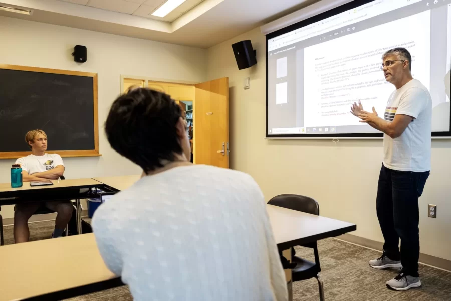 Daniel Riera-Crichton, Betty Doran Stangle Professor of Applied Economics, instructs students during their first day of International Finance seminar on September 4, 2024.
(Theophil Syslo | Bates College)