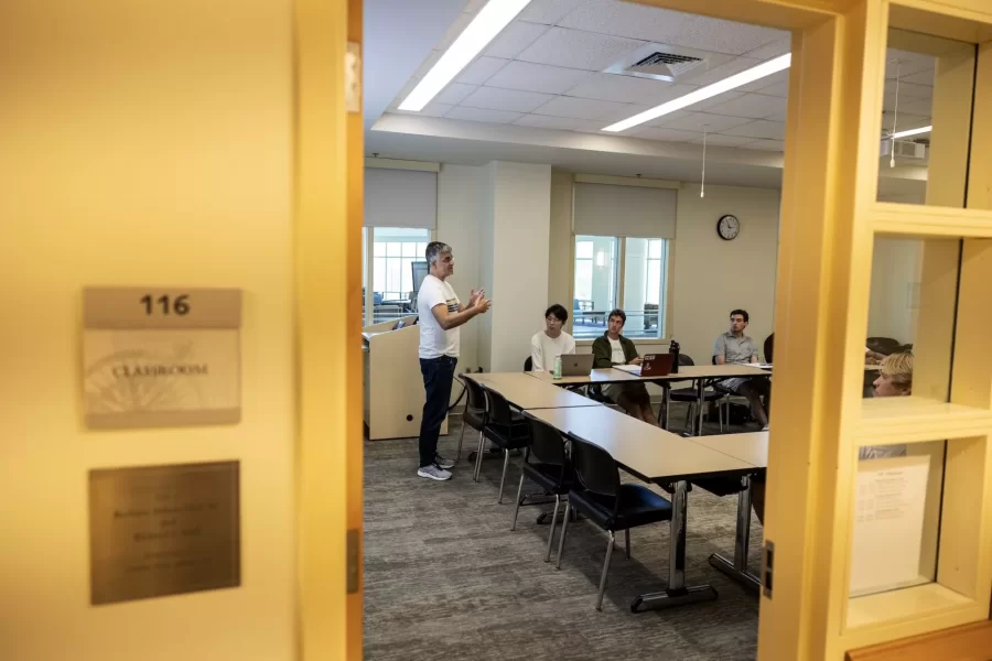 Daniel Riera-Crichton, Betty Doran Stangle Professor of Applied Economics, instructs students during their first day of International Finance seminar on September 4, 2024.
(Theophil Syslo | Bates College)