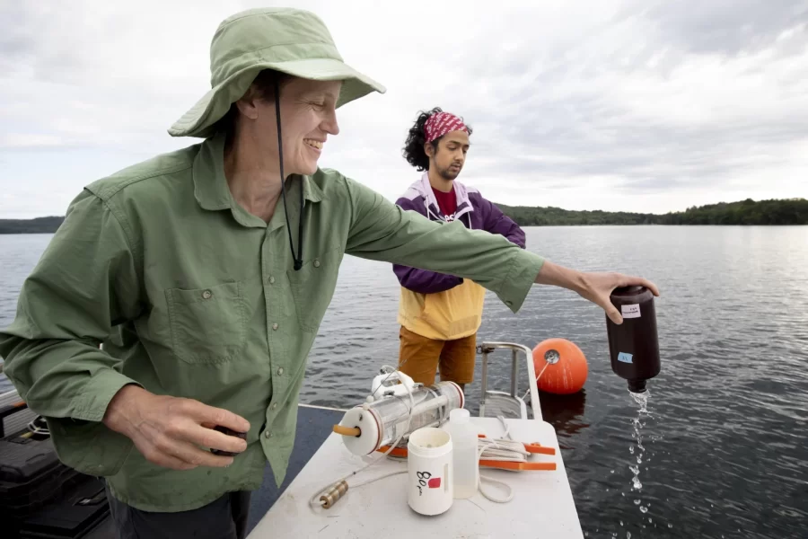 Supervised by Holly Ewing, Christian A. Johnson Professor of Interdisciplinary Studies, environmental studies major Christopher Castaneda ’20 takes water samples from Lake Auburn. He’s studying nutrients produced by algae and consumed by other organisms in the lake. Related to the impacts of algae blooms on water quality, the research supports community efforts to deliver unfiltered public water at the lowest price.
On the boat with
Water treatment manager and lab director Chris Curtis (in blue shirt) and Lindsay Bates and Dan Fortin, water quality technicians (Bruins sweatshirt)
