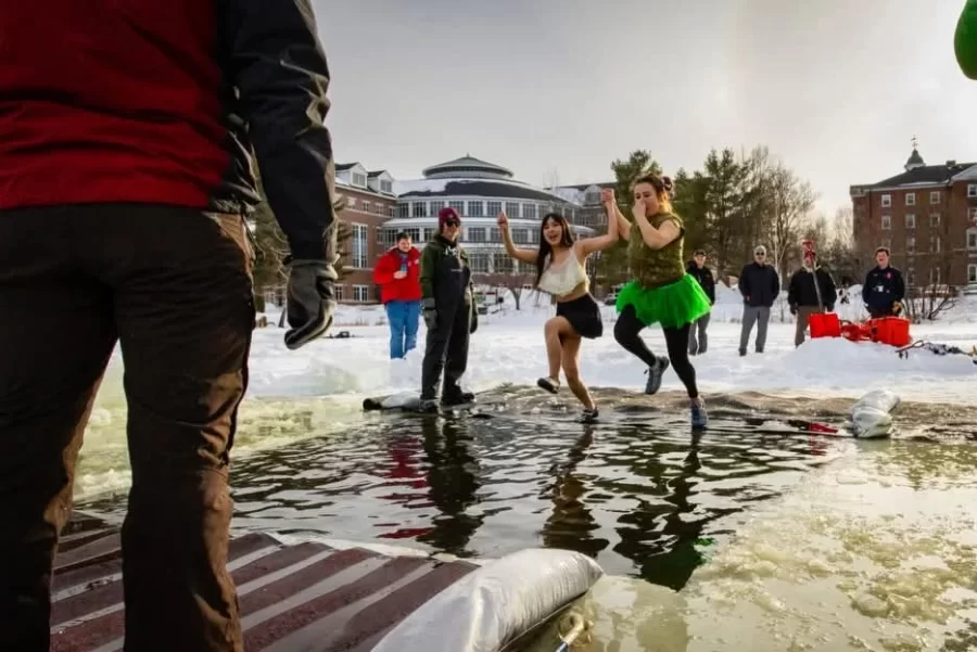 Each Winter Carnival, Bates students jump into Lake Andrews for the annual Puddle Jump!