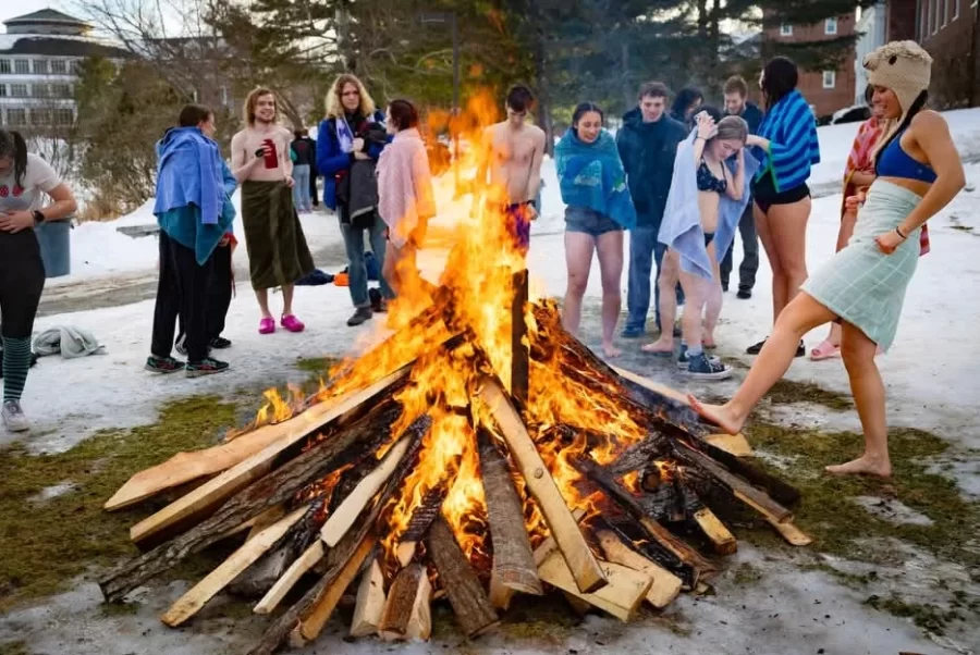 To warm up after Puddle Jump students gather around a bonfire!