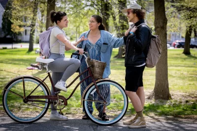 A group of students chat on the quad