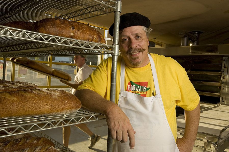 James Amaral '80, founder and president of Borealis Breads, poses for a photograph at his company bakery in Wells, Maine. (Phyllis Graber Jensen/Bates College)