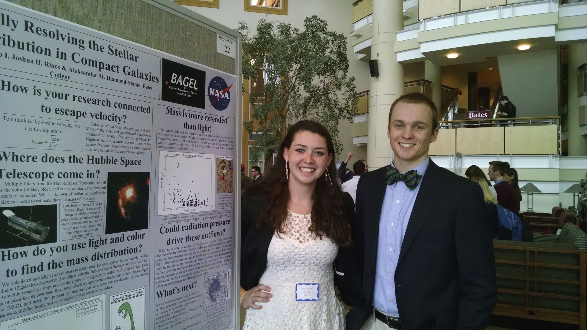 Sophia and Josh standing with their poster