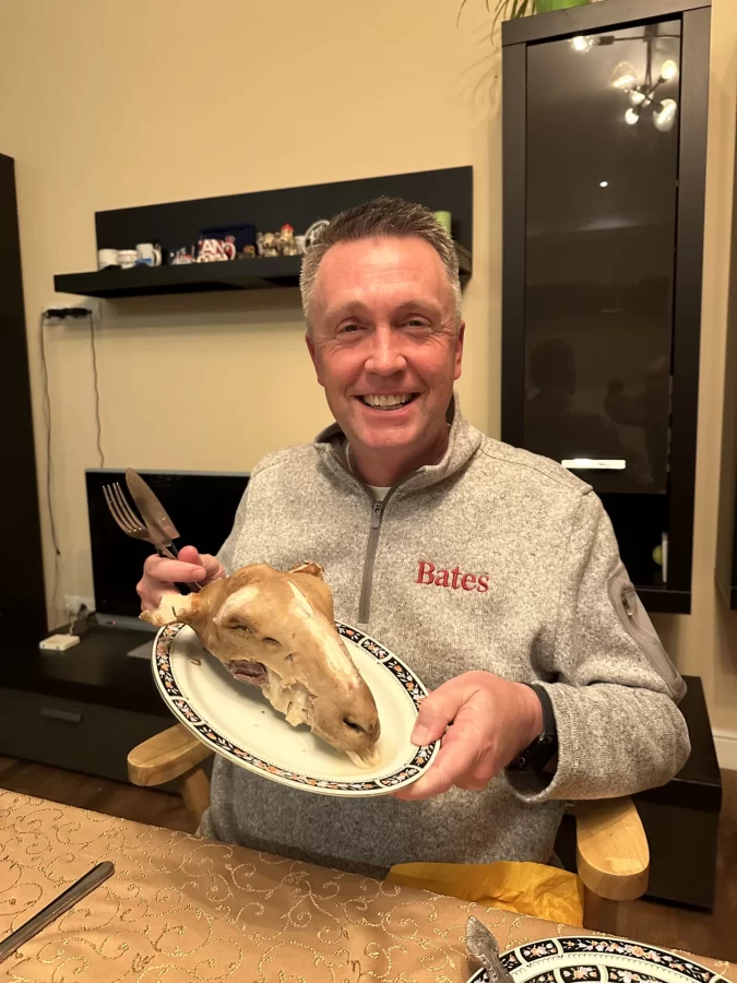 My dad, ready to eat the dinner Malik prepared for him. A ram head is a symbol of respect, and each member of the table eats in accordance with the qualities they want to grow (e.g., eating the ears to become a better listener). The main course consisted of bishbarmak with plenty of konina (horse meat - a classic!) (Photo: Olivia Smith)
