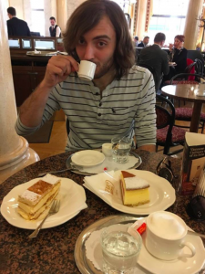 Matthew drinking a Großer Brauner and sampling cake at Café Central, Vienna. Photo: Matthew Johnson