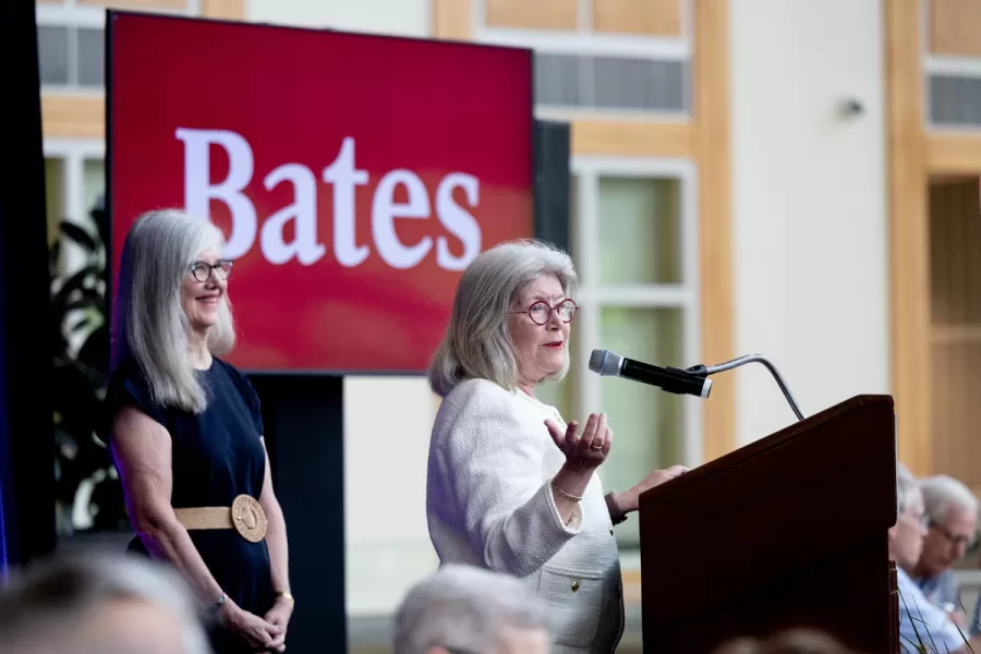 President Garry W. Jenkins addresses members of the Class of 1975 at their 50th Reunion Breakfast in Pettengill Hall’s Perry Atrium on June 6, 2025. He presented to awards: one, Bates Best,  to Susan Bourgault Akie ’75 P’08, and the other. The 2025 50th Reunion Philanthropic Leadership Award, posthumously, to John R. Hester ’75 whose brother Andy Hester (in green), nephew and Andy’s son Geoffrey Hester, John’s brother Mike Hester (in brown) with John’s wife Bronwen, accepted the honor.