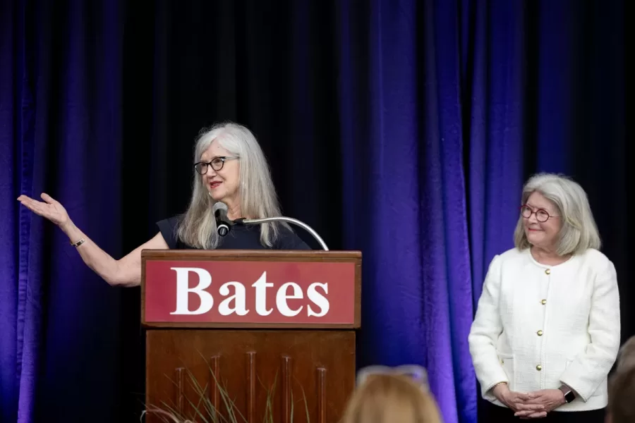 President Garry W. Jenkins addresses members of the Class of 1975 at their 50th Reunion Breakfast in Pettengill Hall’s Perry Atrium on June 6, 2025. He presented to awards: one, Bates Best,  to Susan Bourgault Akie ’75 P’08, and the other. The 2025 50th Reunion Philanthropic Leadership Award, posthumously, to John R. Hester ’75 whose brother Andy Hester (in green), nephew and Andy’s son Geoffrey Hester, John’s brother Mike Hester (in brown) with John’s wife Bronwen, accepted the honor.