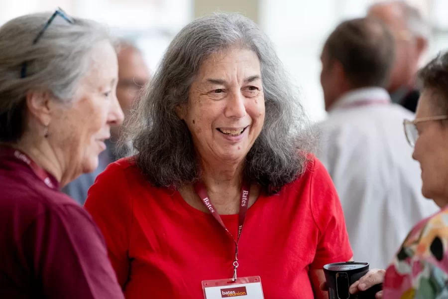 President Garry W. Jenkins addresses members of the Class of 1975 at their 50th Reunion Breakfast in Pettengill Hall’s Perry Atrium on June 6, 2025. He presented to awards: one, Bates Best,  to Susan Bourgault Akie ’75 P’08, and the other. The 2025 50th Reunion Philanthropic Leadership Award, posthumously, to John R. Hester ’75 whose brother Andy Hester (in green), nephew and Andy’s son Geoffrey Hester, John’s brother Mike Hester (in brown) with John’s wife Bronwen, accepted the honor.