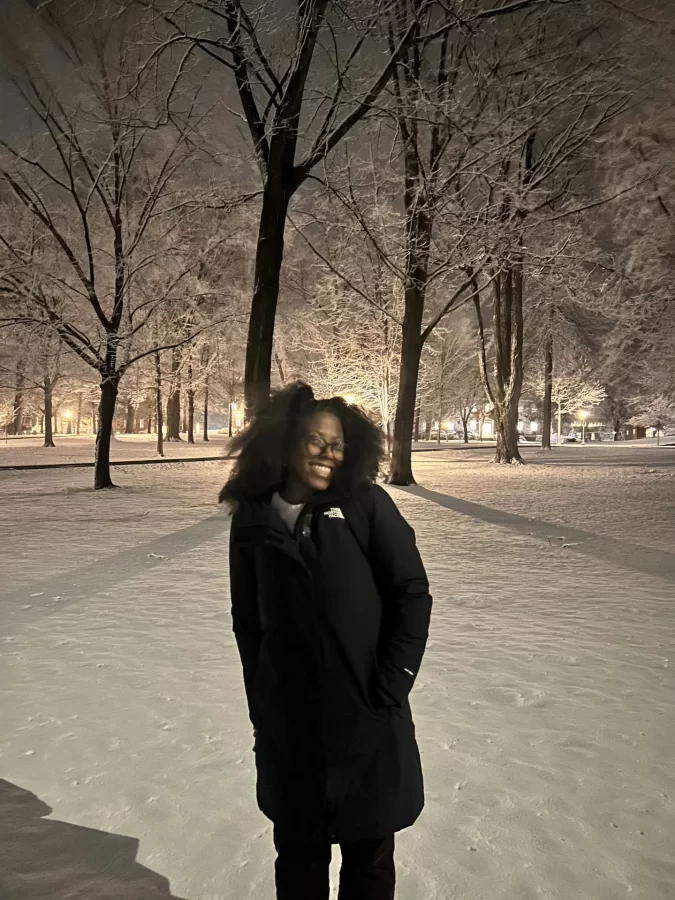 Madisyn enjoying snowfall on campus.
