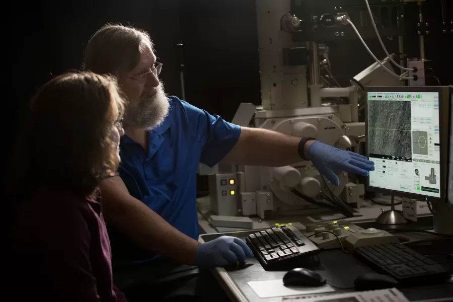 Greg Anderson, assistant in instruction in biology, works with bio major Ruth van Kampen '19 of Brunswick, Maine, in the Carnegie Science Microscopy Lab. 

 About the Laboratory
The Electron Microscopy and X-Ray Microanalysis Laboratory is a shared facility of the Biology and Geology Departments at Bates College. The lab is based upon an analytical, variable vacuum FE-SEM (JEOL JSM-7100FLV with a Noran System 7 EDS System) and is used by faculty and students for research, teaching, and outreach programs in Biology, Geology, and Chemistry.